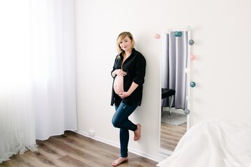 Pregnant woman in black shirt.