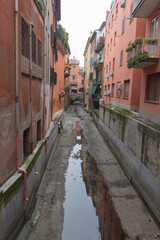 Fototapeta na wymiar Narrow canal in Bologna downtown. Emilia Romagna , Italy.