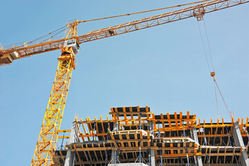 Crane and highrise construction site