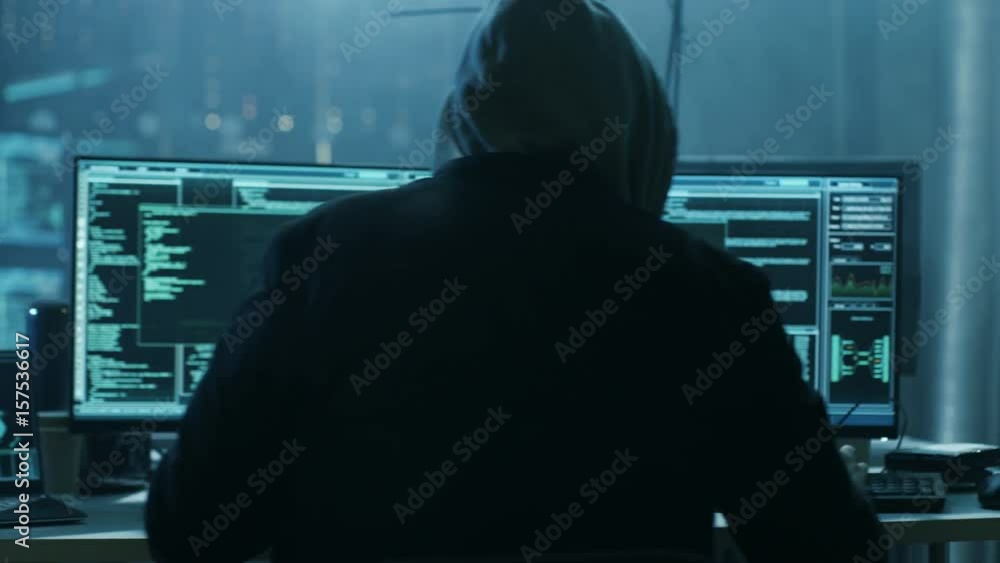 Poster dangerous hooded hacker breaks into government data servers and infects their system with a virus. s
