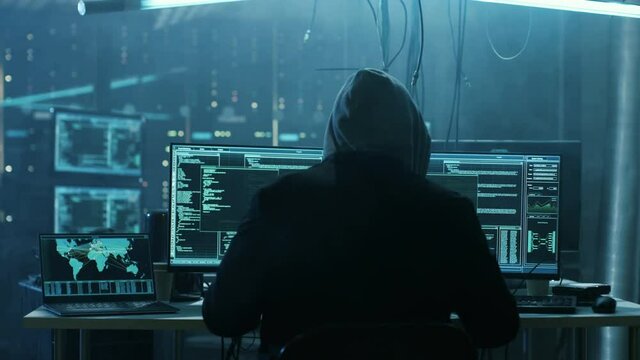 Dangerous Hooded Hacker Breaks into Government Data Servers and Infects Their System with a  Virus. Shot on RED EPIC-W 8K Helium Cinema Camera.