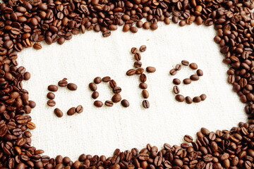 roasted coffee beans with word café in space area , can be used as background