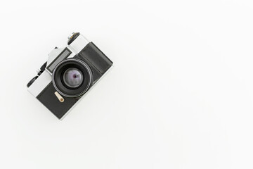 Retro film camera on white. Flat lay, Top view