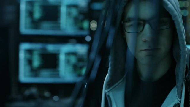 Dangerous Hooded Hacker Breaks into Government Data Servers and Infects Their System with a  Virus. Shot on RED EPIC-W 8K Helium Cinema Camera.