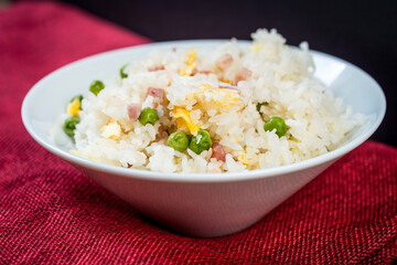 Homemade Chinese fried rice with vegetables and fried eggs