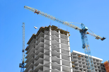 Crane and highrise construction site