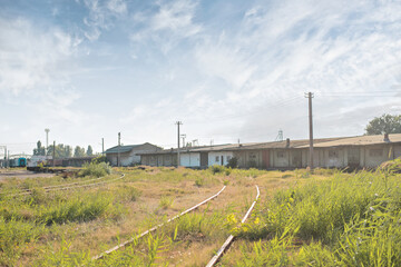 Fototapeta premium Abandoned barn, next to the old railway
