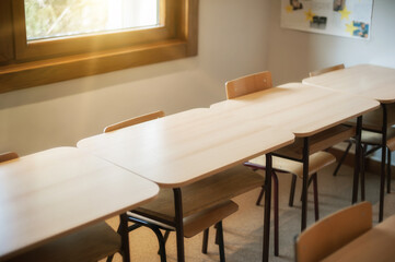Chairs and tables inside empty classroom in primary school