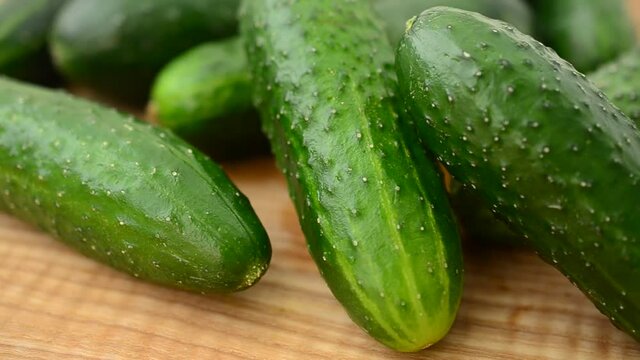 Cucumbers on a board.