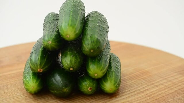 Cucumbers on a board.