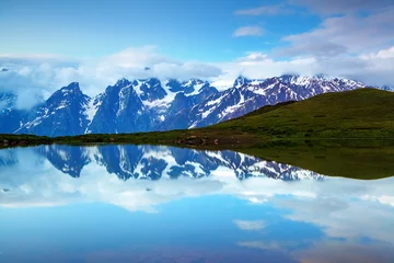 Foto auf Acrylglas High mountain lake, rocky mountains and fog. © Vitalii_Mamchuk