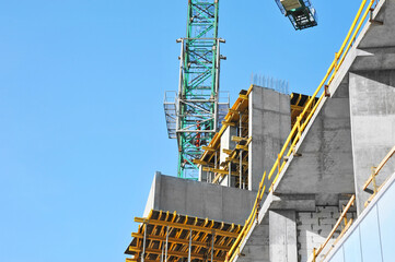 Crane and highrise construction site