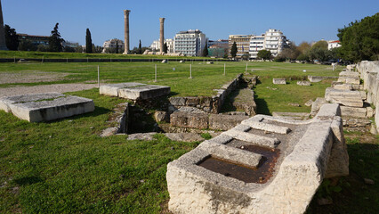Photo of iconic pillars of Temple of Olympian Zeus with view to the Acropolis and the Parthenon,...