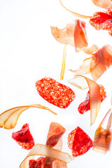Different types of sausages on a transparent table with light