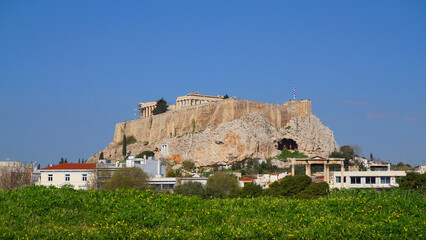 Fototapeta premium Photo of iconic pillars of Temple of Olympian Zeus with view to the Acropolis and the Parthenon, Athens historic center, Attica, Greece 