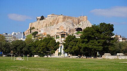 Photo of iconic pillars of Temple of Olympian Zeus with view to the Acropolis and the Parthenon, Athens historic center, Attica, Greece