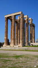 Fototapeta premium Photo of iconic pillars of Temple of Olympian Zeus with view to the Acropolis and the Parthenon, Athens historic center, Attica, Greece 
