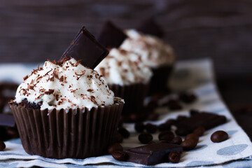 Chocolate-coffee cupcakes on a dark wooden background