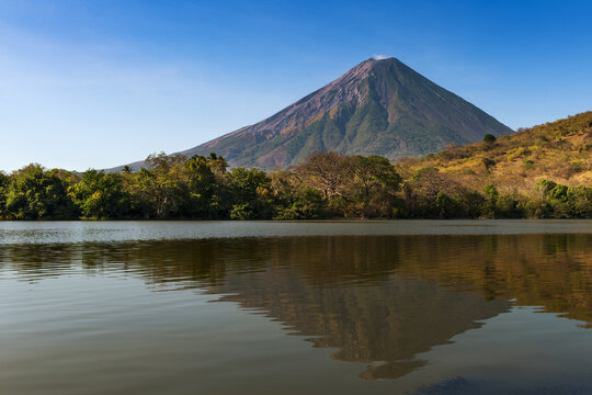 View of the Concepcion Volcano and its reflection on the water in the Ometepe Island, Nicaragua; Concept for travel in Nicaragua and Central America