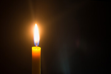 Candlelight on black background at night