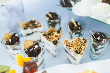 Tiramissu in glasses which stand on dinner table