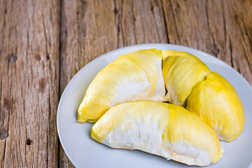Durian fruit in white container Put on the wooden floor