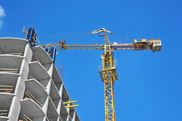 Crane and highrise construction site