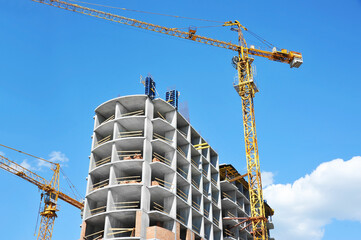 Crane and highrise construction site