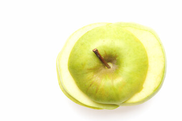 Slices of apple placed on each other making whole fruit