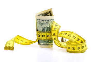 Dollar banknote and measure tape