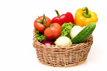 healthy lifestyle concept, lettuce, tomatoes, onions, peppers, cucumber in basket