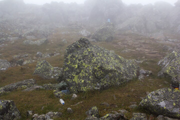 Gloomy mountain landscape. Fog in the mountains, the gloom comes down from the mountains. Mountain...