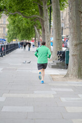 A man is running down London street, Great Britain.