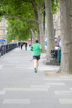 A man is running down London street, Great Britain.