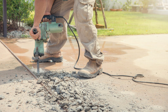 Worker Man Mason Drilling Cement Concrete Floor With Machine