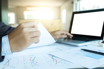 Teamwork process, Two young business colleagues managers crew working new startup project with document graph, digital tablet and laptop computer - meeting in office