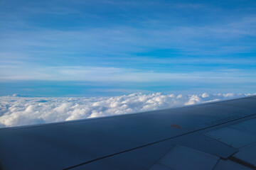 Fototapeta na wymiar blue sky with cloud view from airplane window