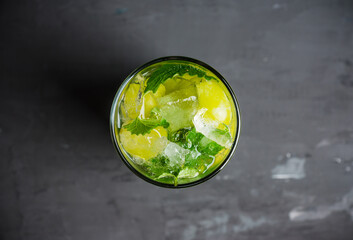 Grape mojito with fresh mint on the rustic background. Shallow depth of field.