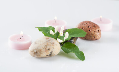 Stones, candles and flowers