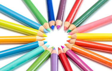 colored pencils in an arrangement on a white background