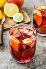 Sangria drink in glass on wooden table
