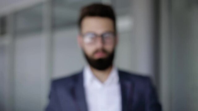 Businessman making touch with his hand like he's using a hologram