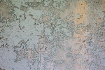 withered blue peeling paint on cement wall texture