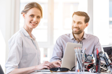 Obraz premium Charming engineer female working in office