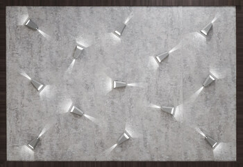 background, advertisement and texture concept - concrete wall with lights.