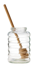 Empty glass honey jar with dipper isolated on white.