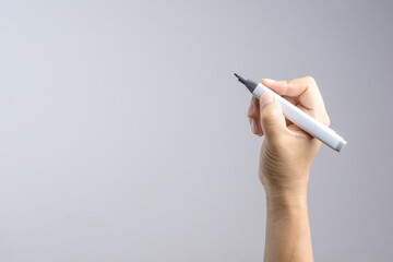 Hand holding gradient level adjustment permanent marker