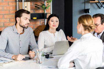 Business colleagues holding meeting in office