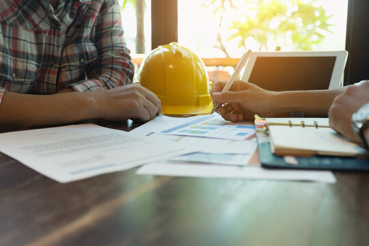 Businessmen are meeting with contractors about business plans.