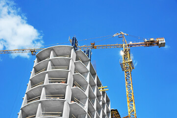 Crane and highrise construction site